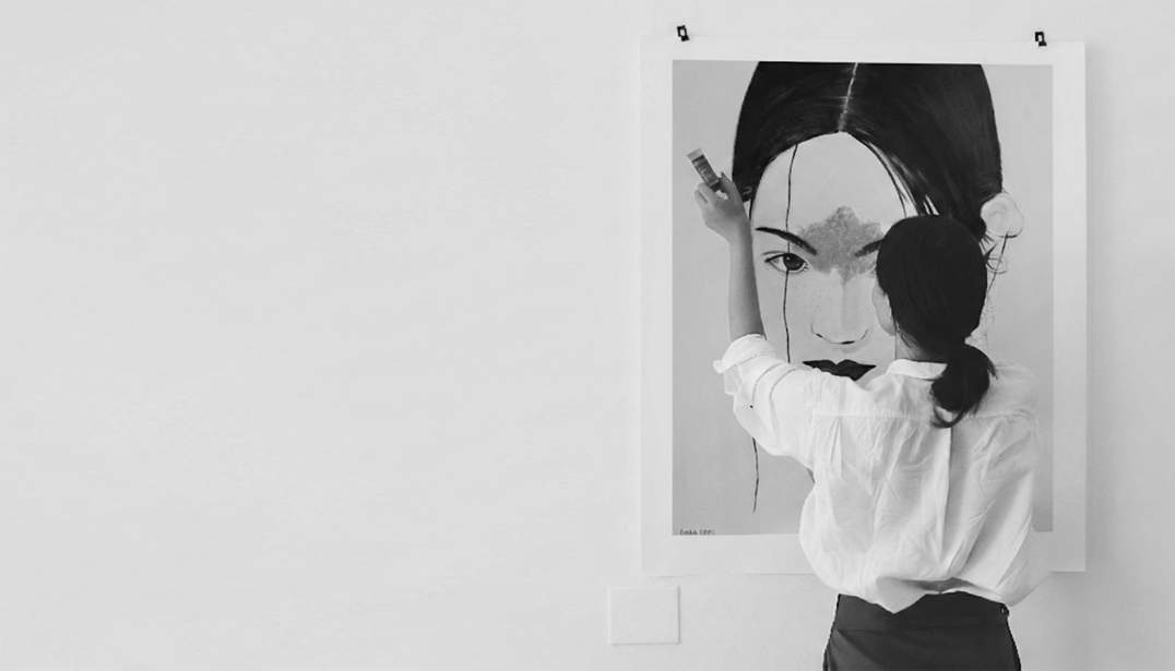 Dana Edri with one of her paintings